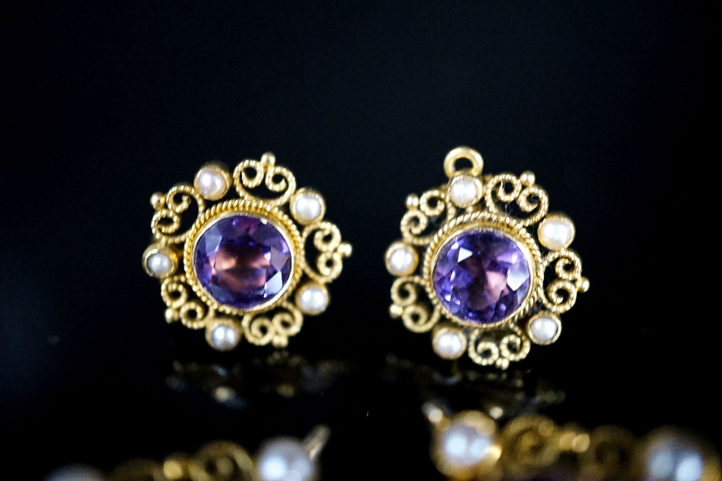 A pair of yellow metal and split pearl mounted pear cut amethyst pendants, 35mm and a pair of similar ear studs, gross weight 23.9 grams.